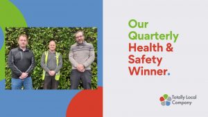 wording - our quarterly health and safety winner, photo of the winner with two colleagues