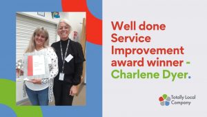 wording - well done service improvement award winner charlene dyer, photo of Charlene with her senior manager, holding her trophy and certificate